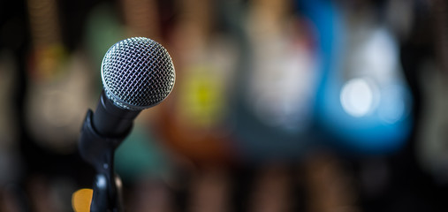 Microphone on stage against a background of auditorium