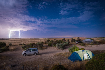 Fototapeta na wymiar Balgowan, Australia - December 19, 2016: Night Thunder Storm with Lightning Strikes at The Gap Camping Ground in Yorke Peninsula, South Australia
