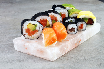 close up of sashimi sushi set with chopsticks and soy - sushi roll with salmon and sushi roll with smoked eel, selective focus.