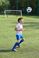 Boy soccer playing with ball