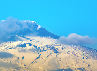 snow Etna mountain smoking steam in Sicily,