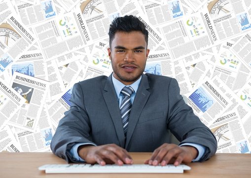 Man at desk against document backdrop
