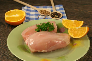 Raw chicken breast and spices close up. Selective focus