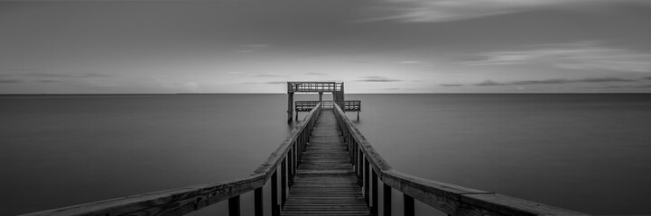 Black and white beach pier in Texas