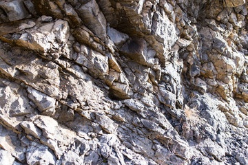 Stone cliffs in the mountains as a background