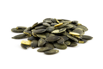 Pumpkin seeds peeled isolated on white background photo.