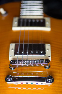Close up of an electric guitar bridge