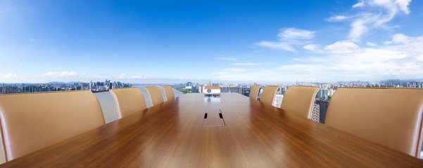 conference table with modern riverbank city
