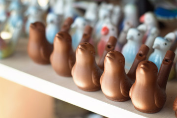 ceramic bird whistles at a street market