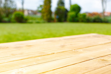 Fototapeta premium Wooden table and green park on background