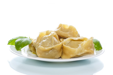 Boiled manti with meat on a plate