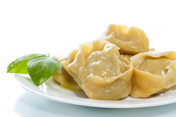 Boiled manti with meat on a plate