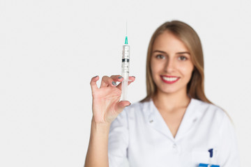 Woman posing with syringe