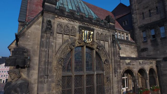 historical town hall with clock - drone view, aerial over the city Chemnitz, German