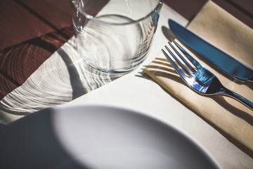 restaurant table setting on wooden table selected focus