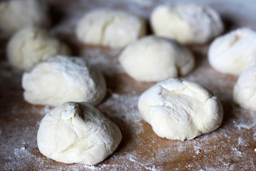 Fototapeta na wymiar Yeast dough for pies, bakery preparation, wheat flour