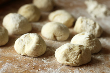 Fototapeta na wymiar Yeast dough for pies, bakery preparation, wheat flour