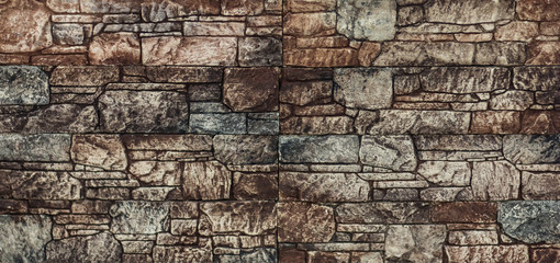 Wall of hard facing stone