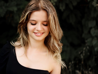 Waisted bust of girl with the look down