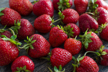 Strawberries on old wooden background