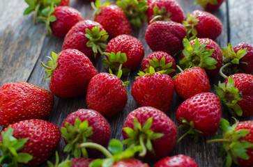 Ripe red strawberries with vibrant lighting