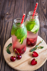 Detox water infused with fruits. Summer water fruit on rustic background