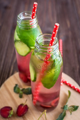 Detox water infused with fruits. Summer water fruit on rustic background