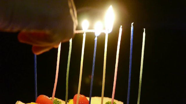 Lit the candles on the cake.