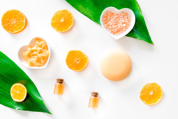 Plakat Aroma spa set. Citrus scrub, salt and lotion on white background top view
