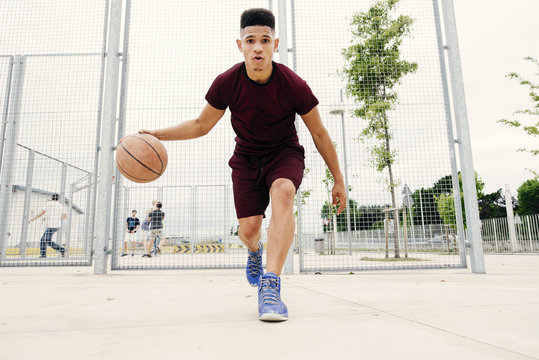 Man running with basketball