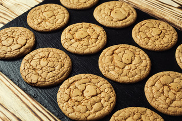 Biscuit sweet cookie background. Domestic stacked butter biscuit pattern concept,close up macro.Homemade cookies on wooden table.Cereal biscuits with the sesame,peanuts,sunflower and amaranth.