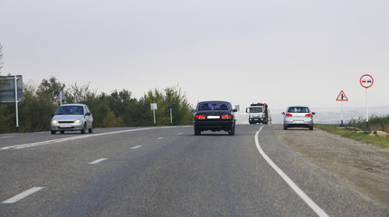 Obraz na płótnie Canvas Highway landscape with moving cars at daytime