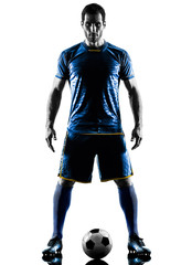 one caucasian soccer player man standing in silhouette isolated on white background