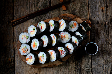 Korean roll Gimbap(kimbob) with ham, sausage, carrots, omelet, crab meat and rice. 