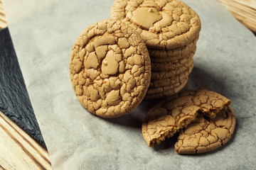 Biscuit sweet cookie background. Domestic stacked butter biscuit pattern concept,close up macro.Homemade cookies on wooden table.Cereal biscuits with the sesame,peanuts,sunflower and amaranth.