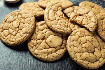 Biscuit sweet cookie background. Domestic stacked butter biscuit pattern concept,close up macro.Homemade cookies on wooden table.Cereal biscuits with the sesame,peanuts,sunflower and amaranth.