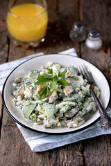 Salad with mussels, cucumber, boiled egg, green onions and dill with yogurt.