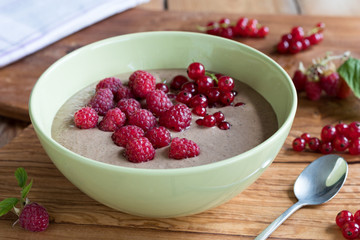Summer breakfast - breakfast bowl with raspberries and currants