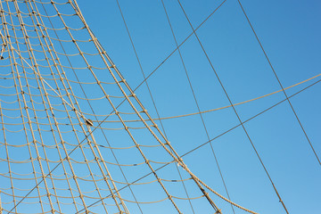Details of vintage wooden pulley block on the bowsprit of an ancient sailing ship; restaurant...