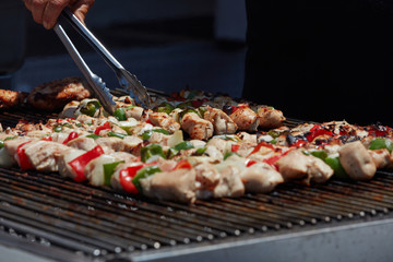 Chicken Kebabs being grilled at an amusement park