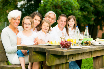 Big Family Having A Picnic In The Garden