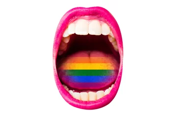 Flag of LGBT in woman's mouth, on tongue, sexy concept of rainbow flag. Female lips with lipstick, white teeth, rainbow in tongue of girl. Woman screams at rally pride about rights of minorities © Tverdokhlib