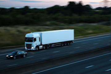 Road transport - white lorry at dusk