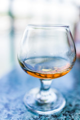 Macro closeup of amaretto, rum, or bourbon drink in glass