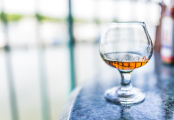 Macro closeup of amaretto, rum, or bourbon drink in glass