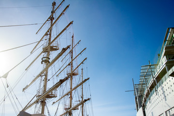 masts of sail vessel on sky background
