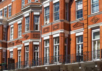Fototapeta premium Windows of the luxury apartments in Mayfair. Centre London residential buildings. 