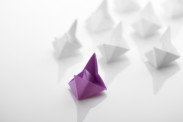 Paper boats on white background