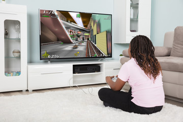 An African Girl Playing Video Games