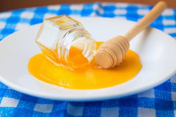 Honey spilled on a plate